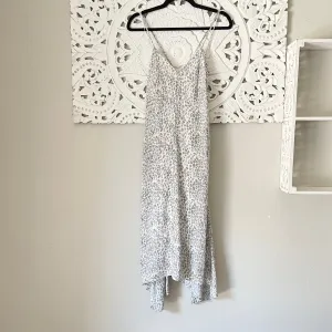 Lovejoy Leopard Asymmetrical Maxi Dress in Grey